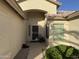 Welcoming front entry with decorative touches and a charming security door, creating a warm first impression at 14878 W Verde Ln, Goodyear, AZ 85395