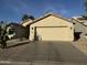 Well-maintained home with a two-car garage, desert landscaping, and a welcoming facade in a serene neighborhood at 14878 W Verde Ln, Goodyear, AZ 85395