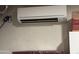 Close-up of a modern air conditioning unit on a wall, providing efficient cooling for the home at 14878 W Verde Ln, Goodyear, AZ 85395