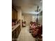 Open kitchen showcasing wood cabinetry, tile floors, and recessed lighting at 14878 W Verde Ln, Goodyear, AZ 85395