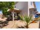 Outdoor patio with covered seating area, barbecue grill, and beautiful landscaping at 16036 N 11Th Ave # 1086, Phoenix, AZ 85023