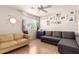Bonus room with beige and gray sofas, ceiling fan and laminate wood flooring at 16036 N 11Th Ave # 1086, Phoenix, AZ 85023