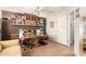 Bonus room with brown accent wall, desk, ceiling fan and laminate wood flooring at 16036 N 11Th Ave # 1086, Phoenix, AZ 85023