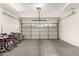 Spacious two-car garage with an automatic door, overhead lighting, and ample storage space at 16036 N 11Th Ave # 1086, Phoenix, AZ 85023