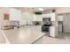 Bright kitchen with white cabinetry, stainless steel appliances, and a tiled backsplash for a clean, modern look at 16036 N 11Th Ave # 1086, Phoenix, AZ 85023