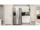 Kitchen featuring stainless steel refrigerator and appliances, lots of storage and white cabinetry at 16036 N 11Th Ave # 1086, Phoenix, AZ 85023