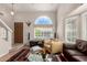 Comfortable living room with a warm, inviting ambiance, highlighted by a stylish rug and plenty of seating at 16036 N 11Th Ave # 1086, Phoenix, AZ 85023