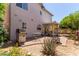Outdoor patio area with a grill, dining set, and desert plants, perfect for entertaining or relaxation at 16036 N 11Th Ave # 1086, Phoenix, AZ 85023