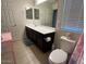 Bathroom featuring a vanity, sink, mirror, toilet and a shower with a floral curtain at 1718 S 82Nd Way, Mesa, AZ 85209