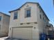 Two-story home featuring a two-car garage and neutral stucco exterior at 1718 S 82Nd Way, Mesa, AZ 85209