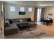 Open living room featuring a plush sectional sofa and modern decor at 1718 S 82Nd Way, Mesa, AZ 85209