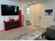 Cozy living room featuring a large TV and modern storage solutions at 1718 S 82Nd Way, Mesa, AZ 85209