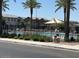 Community pool area with palm trees and lounging chairs at 1718 S 82Nd Way, Mesa, AZ 85209