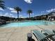 Inviting community pool with sunny lounge area and well-maintained surroundings at 1718 S 82Nd Way, Mesa, AZ 85209