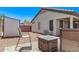 Backyard with a covered patio, outdoor seating, a fire pit, and a storage shed at 18555 N 114Th Ave, Surprise, AZ 85378