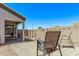 This backyard boasts a tiled patio, decorative string lights, and comfortable seating at 18555 N 114Th Ave, Surprise, AZ 85378