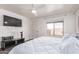 Bright bedroom with ceiling fan and window at 18555 N 114Th Ave, Surprise, AZ 85378