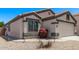 Charming single-story home with a well-maintained front yard and attached two-car garage at 18555 N 114Th Ave, Surprise, AZ 85378