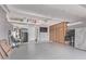 Spacious garage with ample storage, including cabinets and overhead racks at 18555 N 114Th Ave, Surprise, AZ 85378