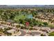 Aerial view pinpointing a well-situated property in a golf community with lush landscaping and nearby golf course at 18823 N 97Th Ln, Peoria, AZ 85382