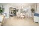Bright dining room with natural light, stylish furnishings, and patio access at 18823 N 97Th Ln, Peoria, AZ 85382