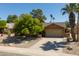 Charming home with desert landscaping and a two-car garage at 18823 N 97Th Ln, Peoria, AZ 85382