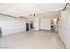 Spacious garage with epoxy floors and built-in storage cabinets at 18823 N 97Th Ln, Peoria, AZ 85382