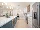 Bright kitchen with stainless steel appliances and a large island perfect for entertaining and food preparation at 18823 N 97Th Ln, Peoria, AZ 85382