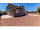Spacious backyard featuring a low-maintenance desert landscape and a covered parking area at 18868 E Canary Way, Queen Creek, AZ 85142