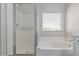 Up-close shot of shower and soaking tub inside bathroom at 18868 E Canary Way, Queen Creek, AZ 85142