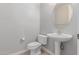 Powder room with pedestal sink, modern faucet, and neutral wall color at 18868 E Canary Way, Queen Creek, AZ 85142