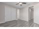 Bedroom showcasing wood floors, ceiling fan and closet at 18868 E Canary Way, Queen Creek, AZ 85142