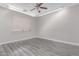 Bedroom with wood floors, ceiling fan and window at 18868 E Canary Way, Queen Creek, AZ 85142