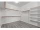 Walk-in closet with built-in shelving at 18868 E Canary Way, Queen Creek, AZ 85142