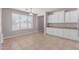 Bright dining room with ample natural light, white trim and tiled floors at 18868 E Canary Way, Queen Creek, AZ 85142