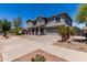 Attractive two-story home with desert landscaping, covered porch, and attached two-car garage at 18868 E Canary Way, Queen Creek, AZ 85142