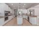 Bright open kitchen featuring stainless steel appliances, an island, and plenty of storage at 18868 E Canary Way, Queen Creek, AZ 85142