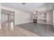 Open living room with a fireplace, a ceiling fan and a combination of tile and wood-look floors at 18868 E Canary Way, Queen Creek, AZ 85142