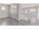 Loft area with wood-look floors and natural light coming through the windows at 18868 E Canary Way, Queen Creek, AZ 85142