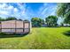 Spacious backyard with flourishing green grass and mature landscaping at 20042 W Dunlap Rd, Buckeye, AZ 85326