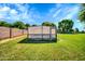 Backyard featuring a garden, with mature landscaping and a lush lawn at 20042 W Dunlap Rd, Buckeye, AZ 85326