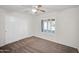 Bedroom featuring carpet, a ceiling fan, and white plantation shutters at 20042 W Dunlap Rd, Buckeye, AZ 85326