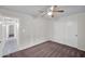 Bedroom features a ceiling fan, sliding closet doors, and view into the bathroom at 20042 W Dunlap Rd, Buckeye, AZ 85326
