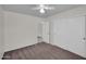 Bedroom with neutral walls, ceiling fan, and closet featuring sliding doors at 20042 W Dunlap Rd, Buckeye, AZ 85326