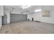 A large open garage with plenty of potential for parking and storage at 20042 W Dunlap Rd, Buckeye, AZ 85326