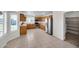 Spacious kitchen featuring stainless steel appliances, light wood cabinets, and light countertops at 20042 W Dunlap Rd, Buckeye, AZ 85326