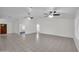 Spacious living room featuring a neutral color palette, tile flooring, and abundant natural light, perfect for entertaining at 20042 W Dunlap Rd, Buckeye, AZ 85326