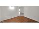 Inviting room features wood floors, neutral walls, and archway entrance at 20042 W Dunlap Rd, Buckeye, AZ 85326