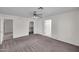 Spacious main bedroom with neutral walls and carpet, ceiling fan, and walk-in closet at 20042 W Dunlap Rd, Buckeye, AZ 85326