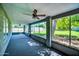Enclosed patio featuring ceiling fans and views of the expansive, grassy backyard at 20042 W Dunlap Rd, Buckeye, AZ 85326